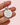 Keychain with 'DON'T LOSE YOUR FUCKING KEYS' text held by a hand on a white background