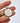 Keychain with 'DON'T LOSE YOUR FUCKING KEYS' text held by a hand on a white background