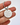 Keychain with 'DON'T LOSE YOUR FUCKING KEYS' text held by a hand on a white background
