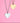 Two heart-shaped pendants on chains with 'GRA' engraving against a pink background